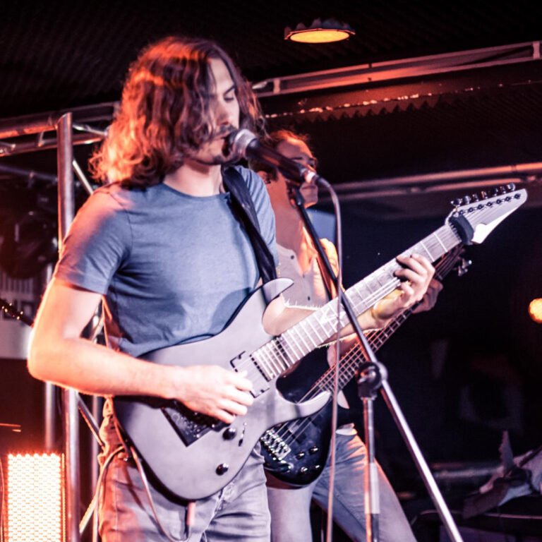 Playing guitar and singing live